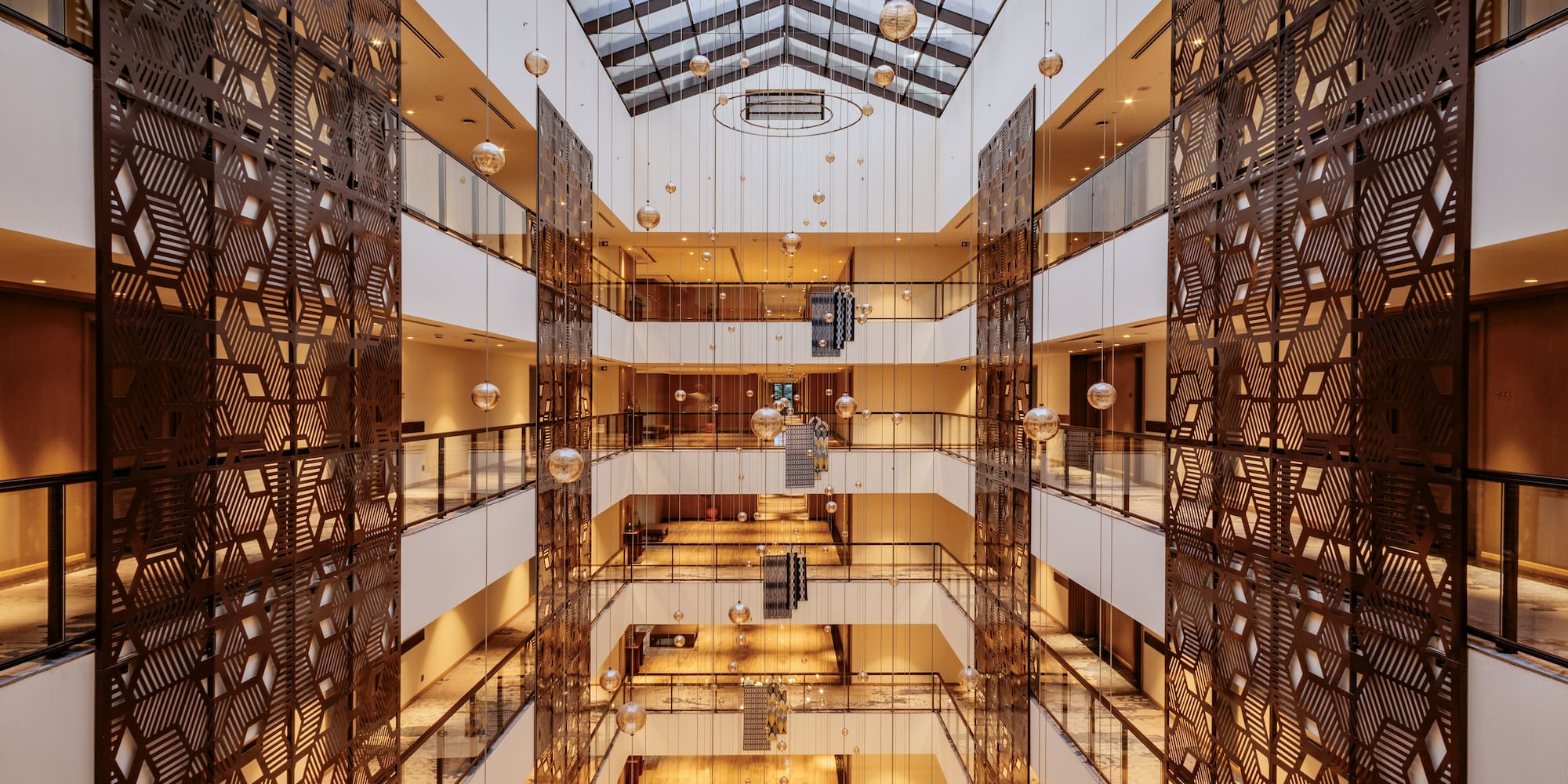 a building with many floors and glass walls
