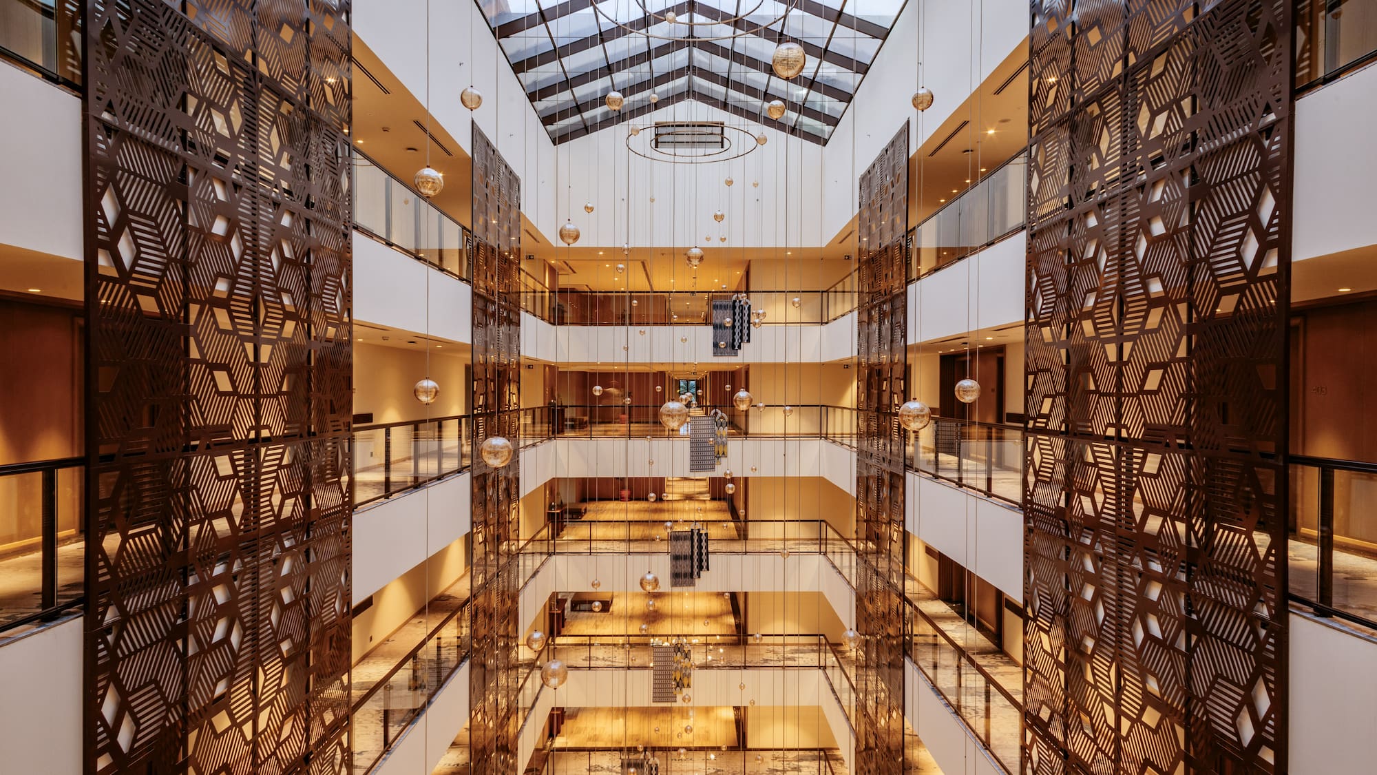 a building with many floors and glass walls