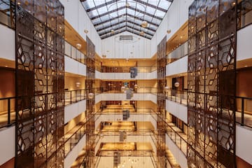 a building with many floors and glass walls