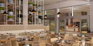 a restaurant with tables and chairs