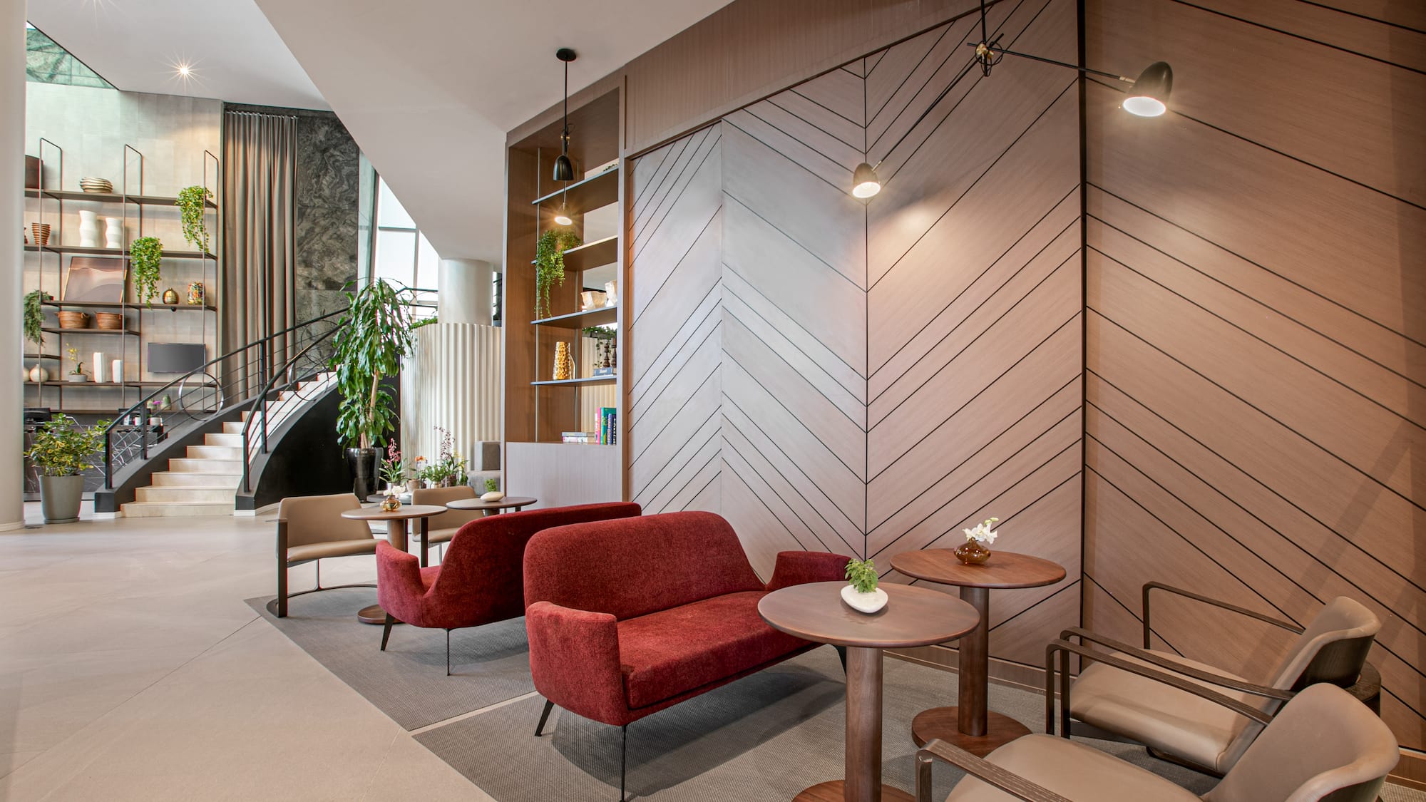 a room with a couch and chairs