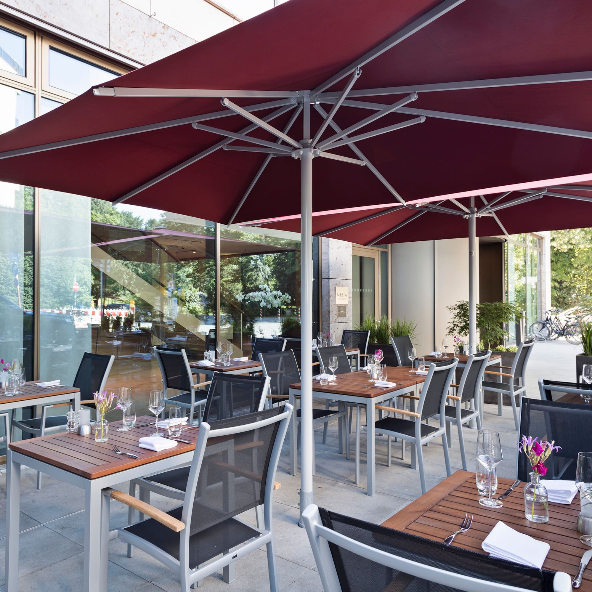 a patio with tables and chairs