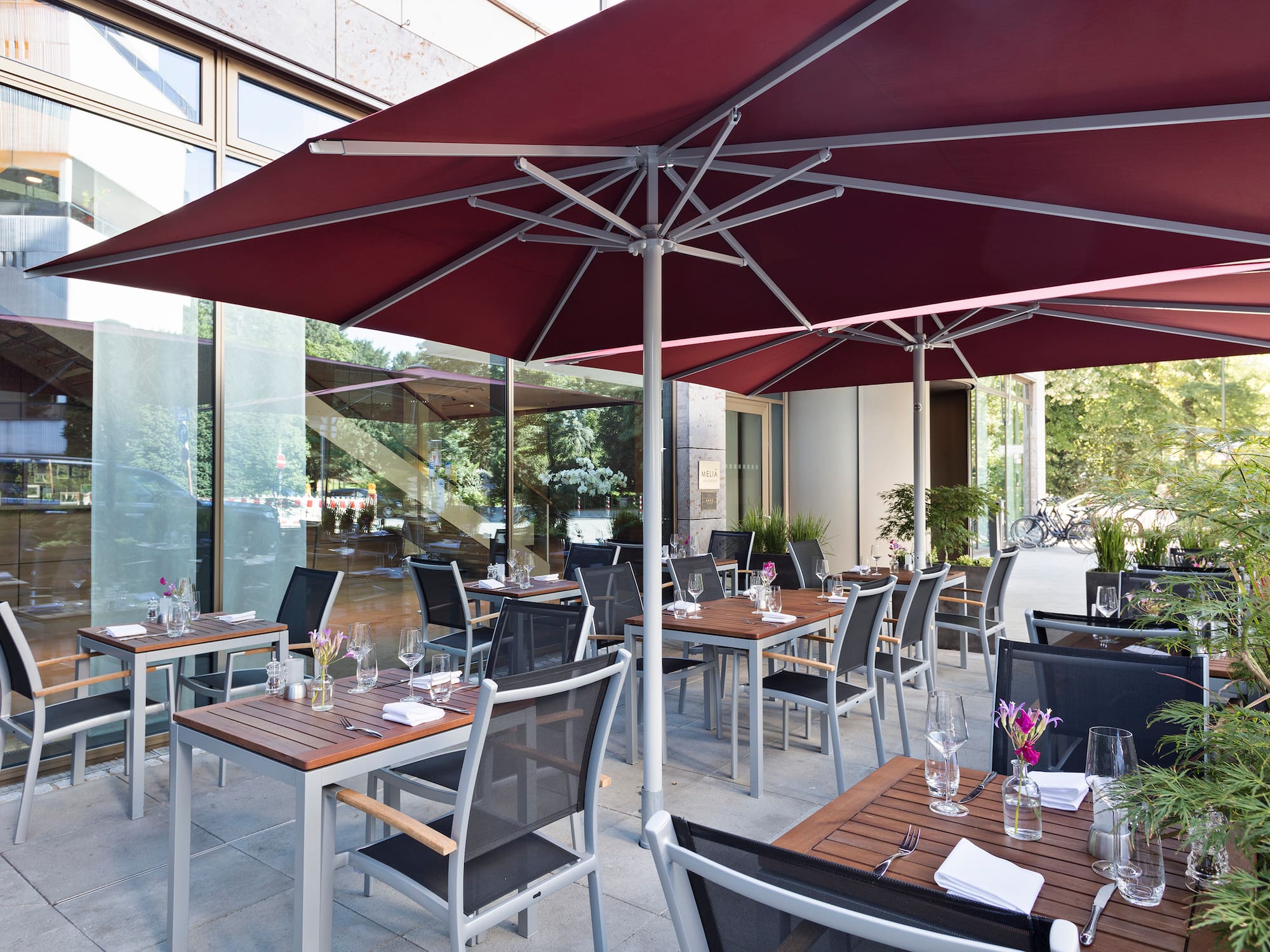 a patio with tables and chairs
