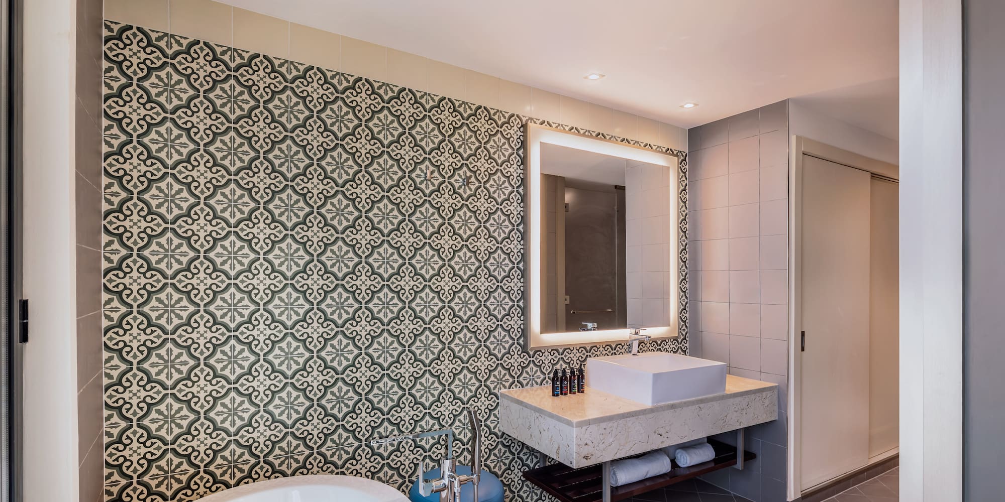 a bathroom with a tub and sink