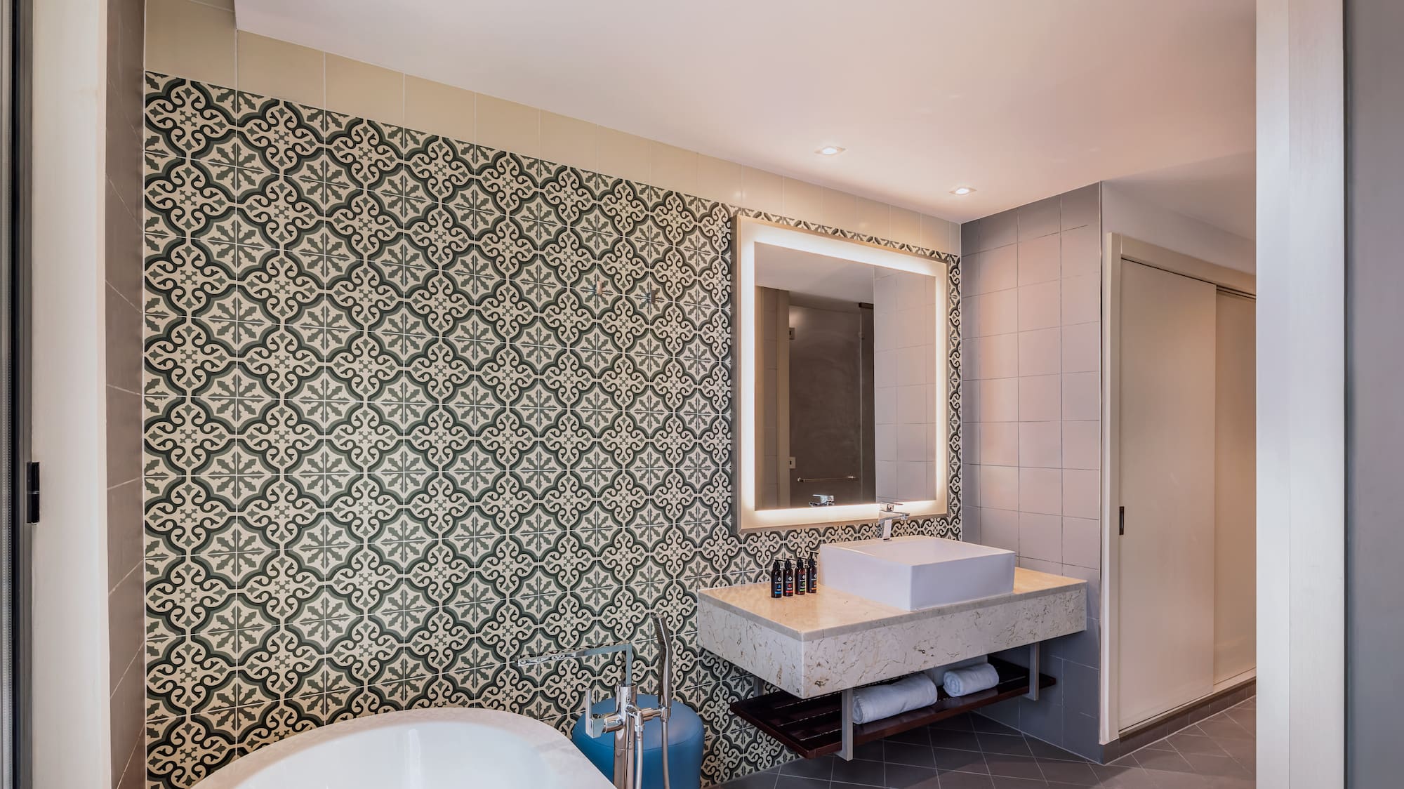 a bathroom with a tub and sink