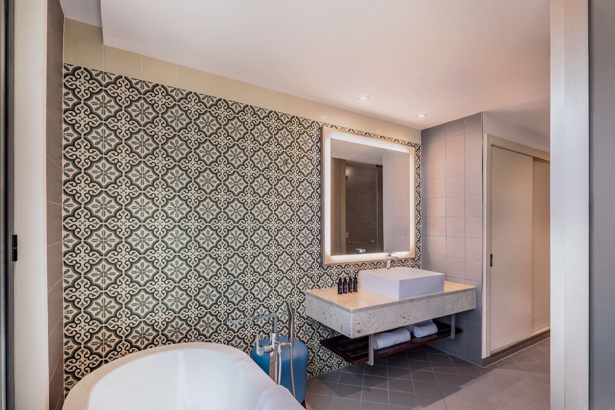 a bathroom with a tub and sink