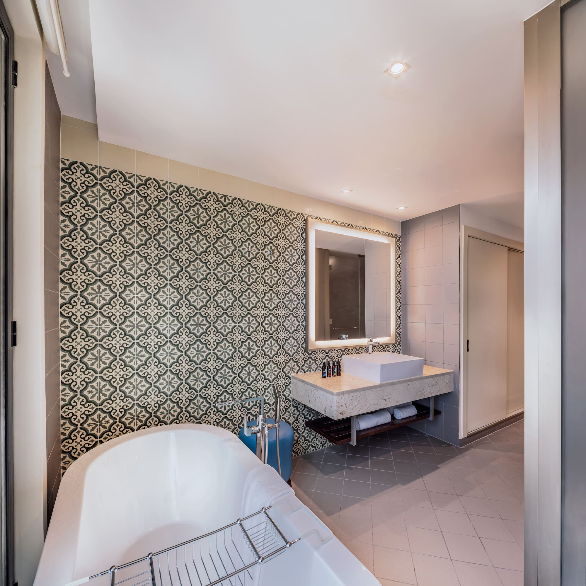 a bathroom with a tub and sink