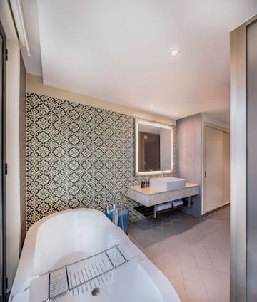 a bathroom with a tub and sink