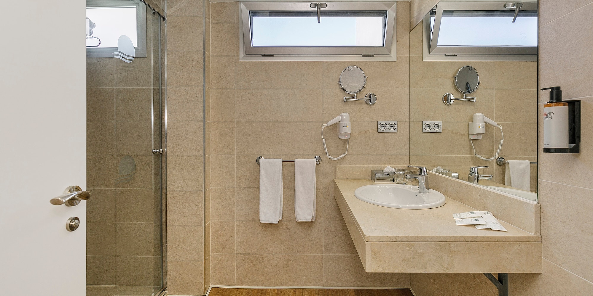 a bathroom with a shower and sink