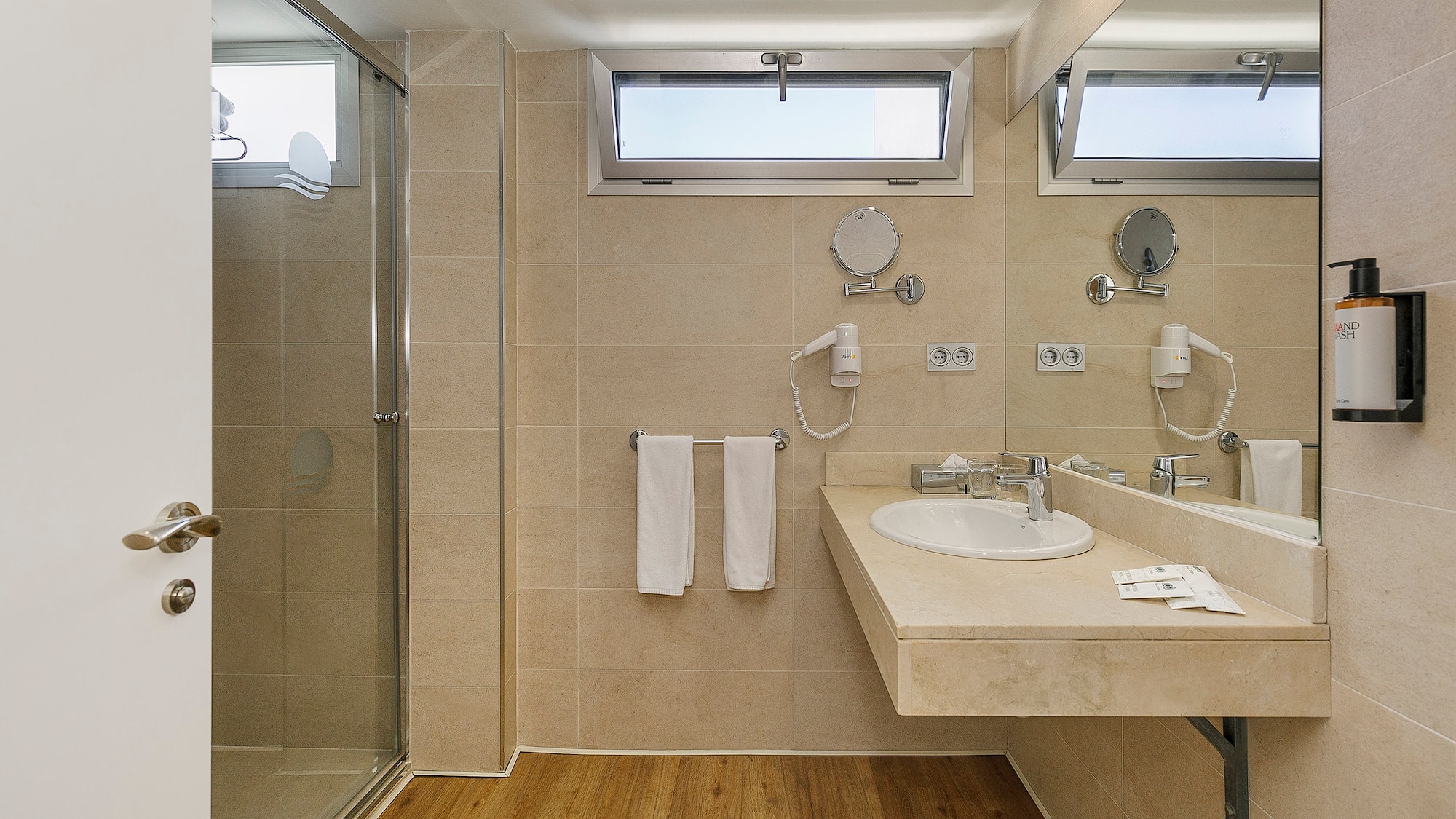 a bathroom with a shower and sink
