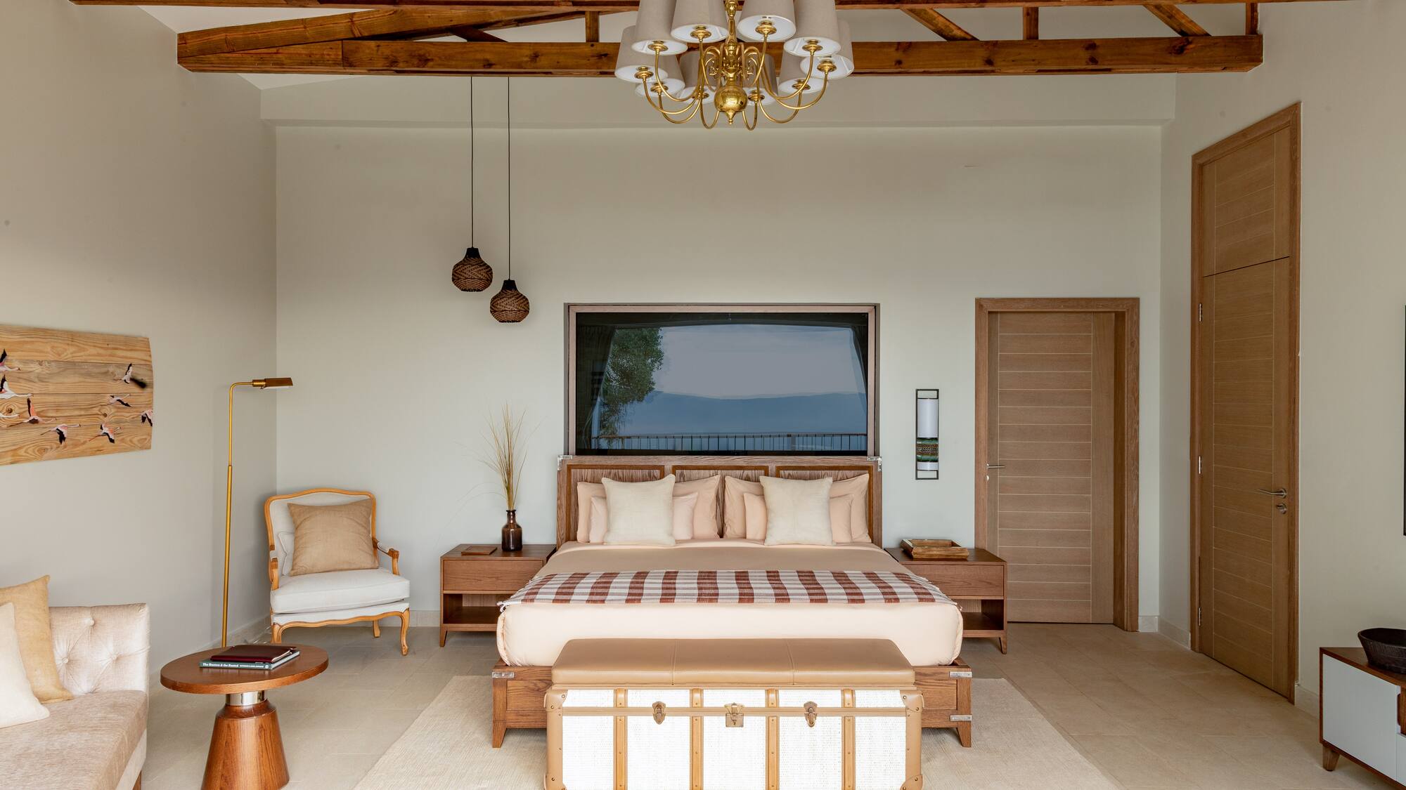 a bedroom with a bed and a couch