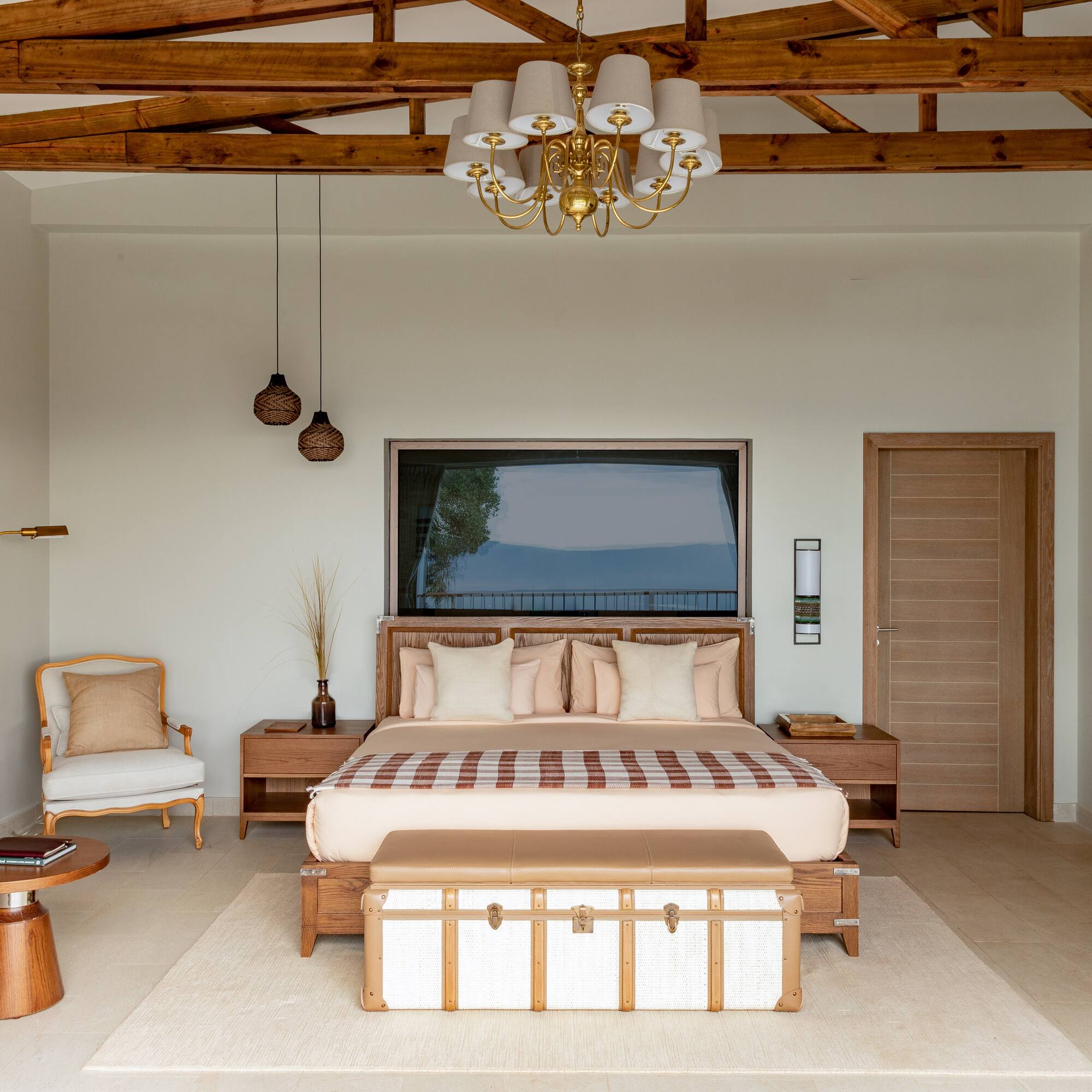 a bedroom with a bed and a couch