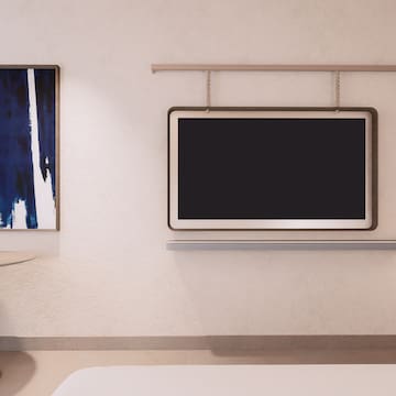 a room with a tv on the wall