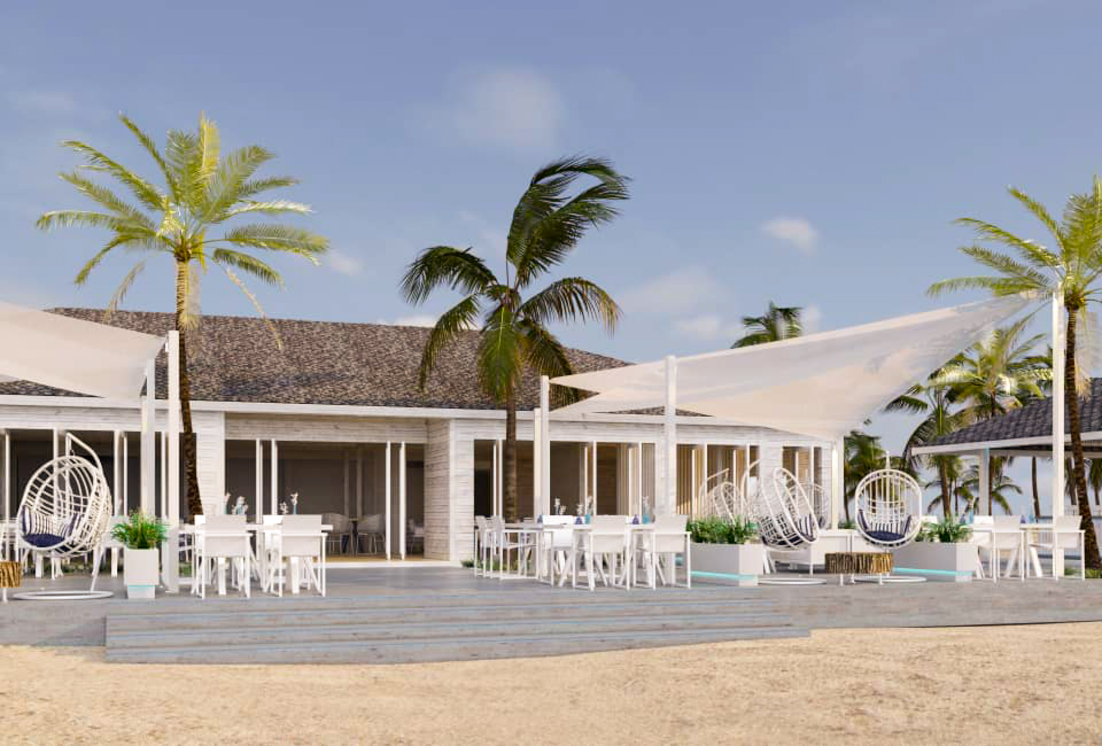 a building with palm trees and a white tent