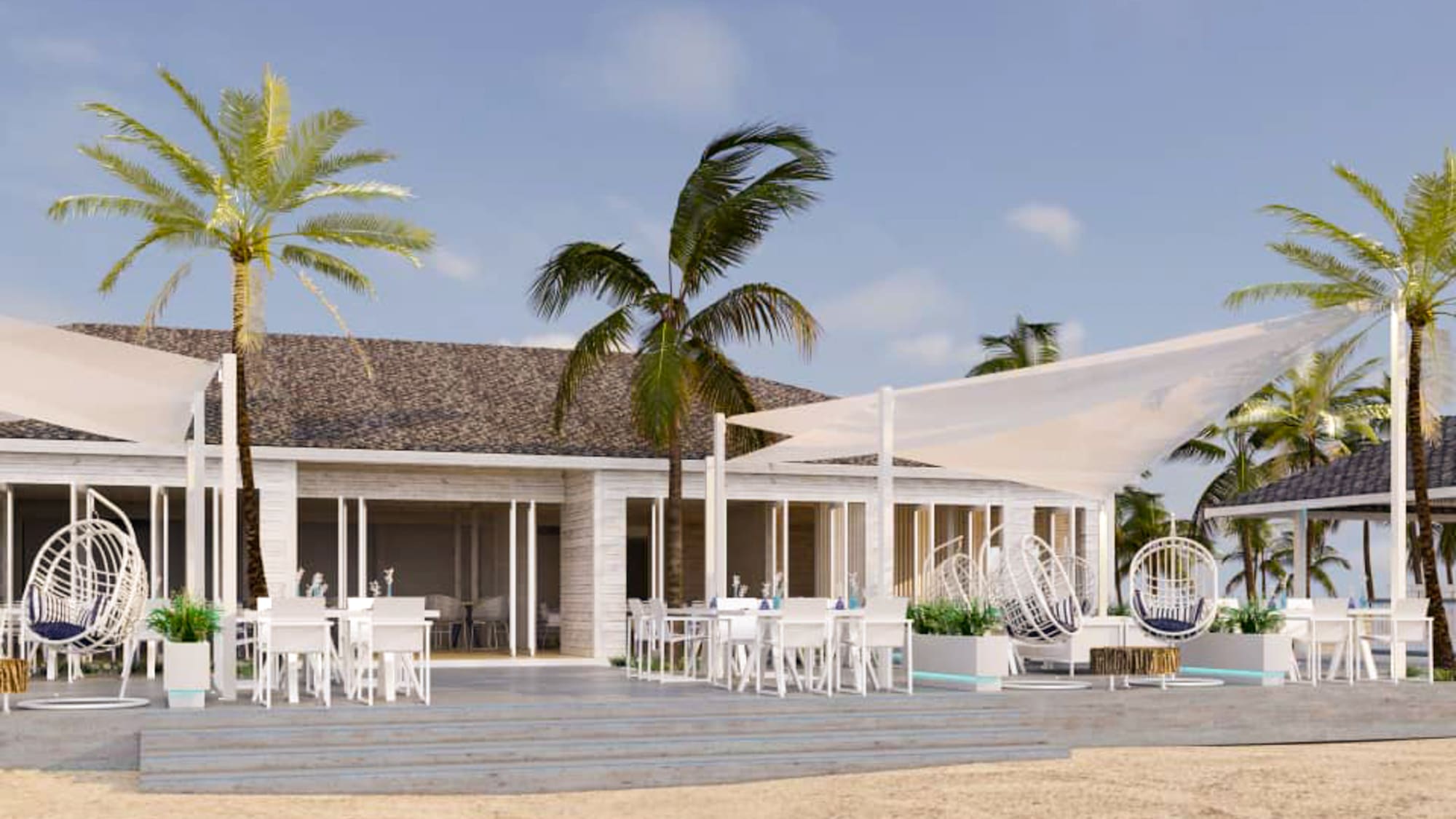 a building with palm trees and a white tent