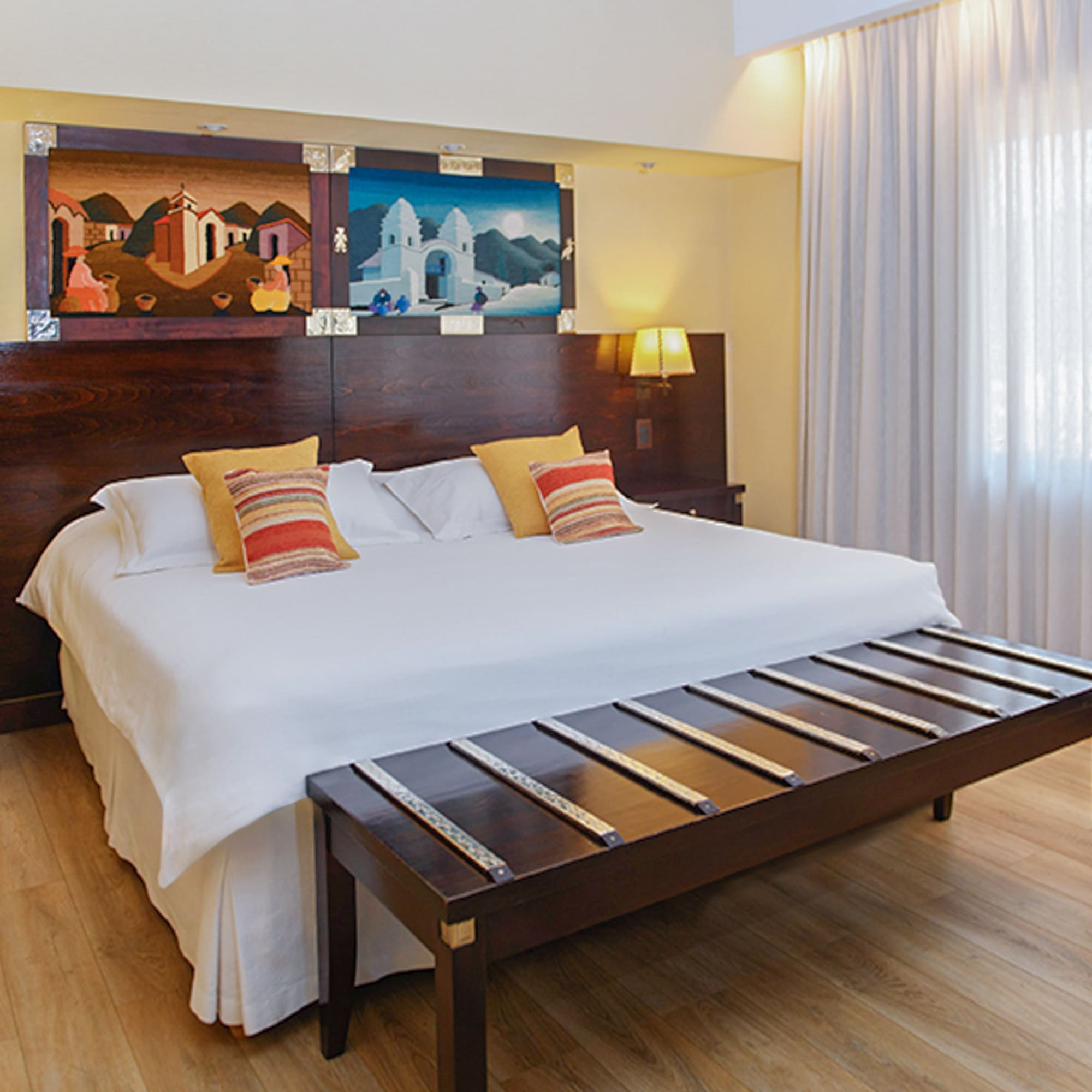 a bed with pillows and a table in a room