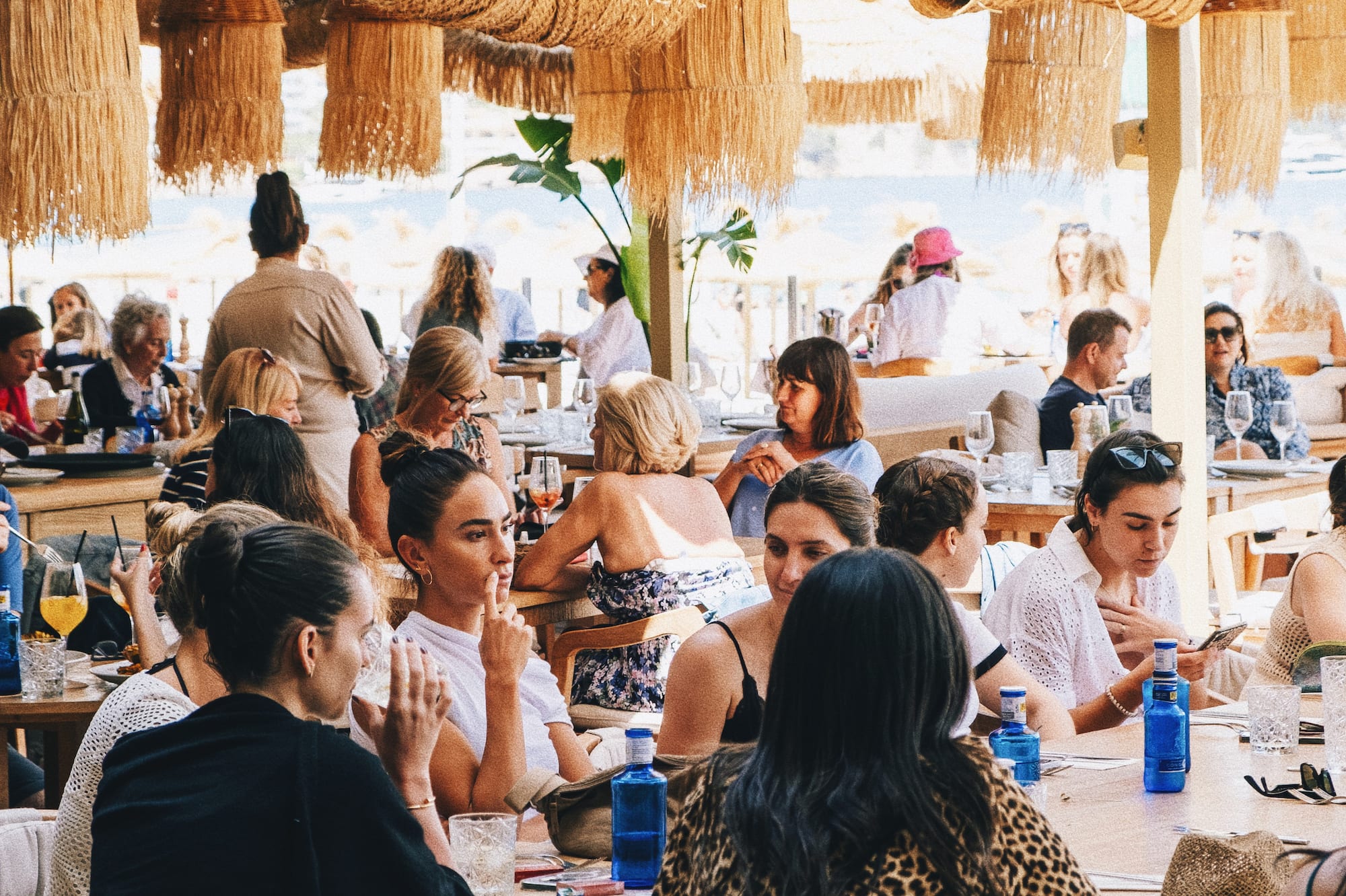 a group of people sitting at tables