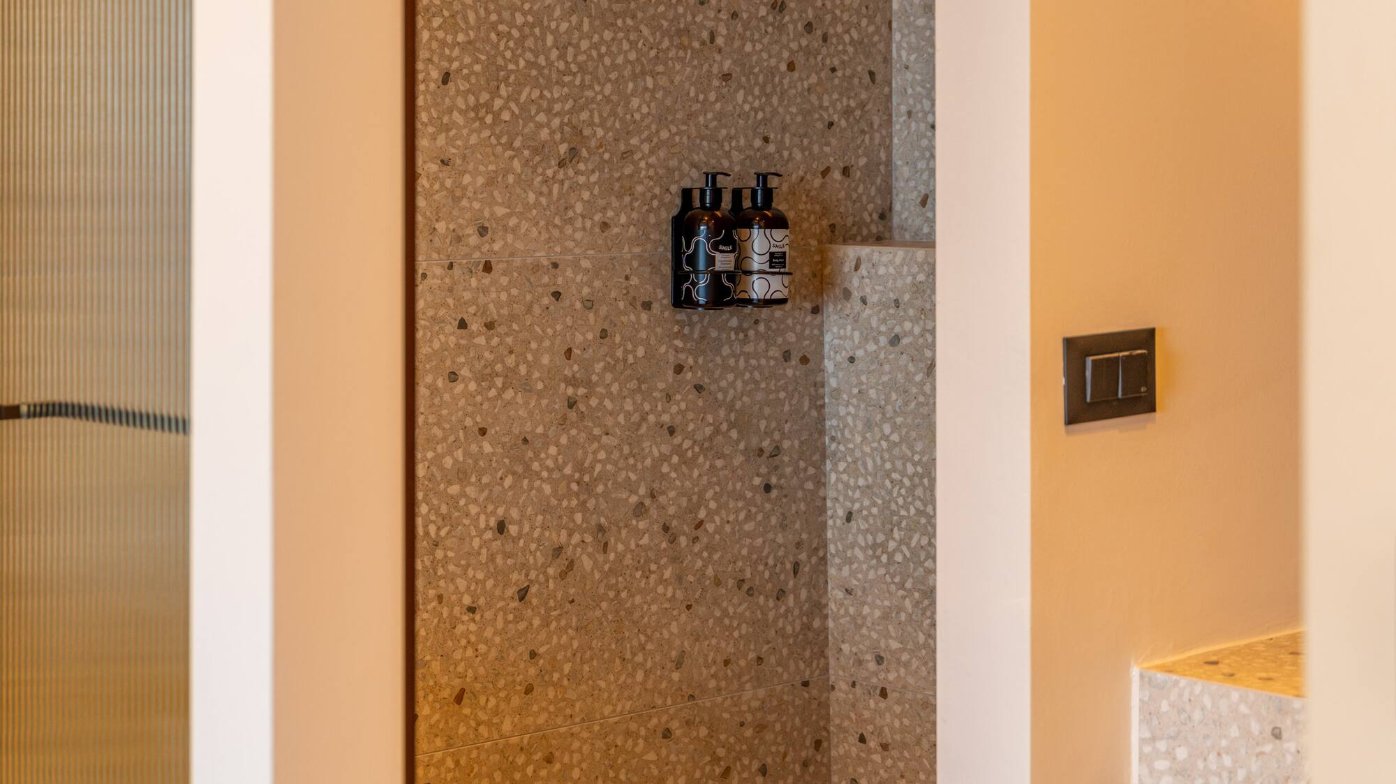 a shower with a shower and a sink