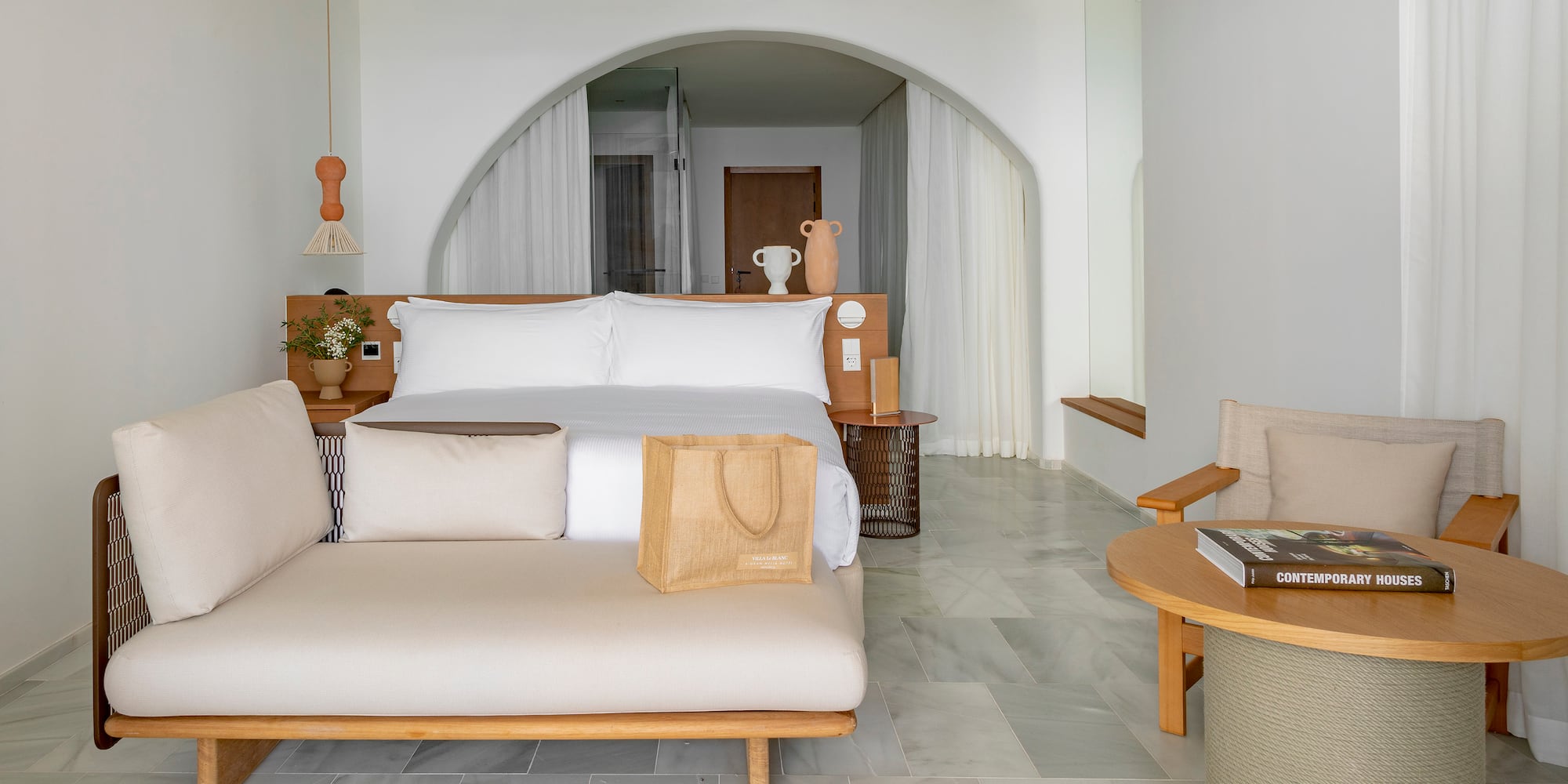 a room with a bed and a fan