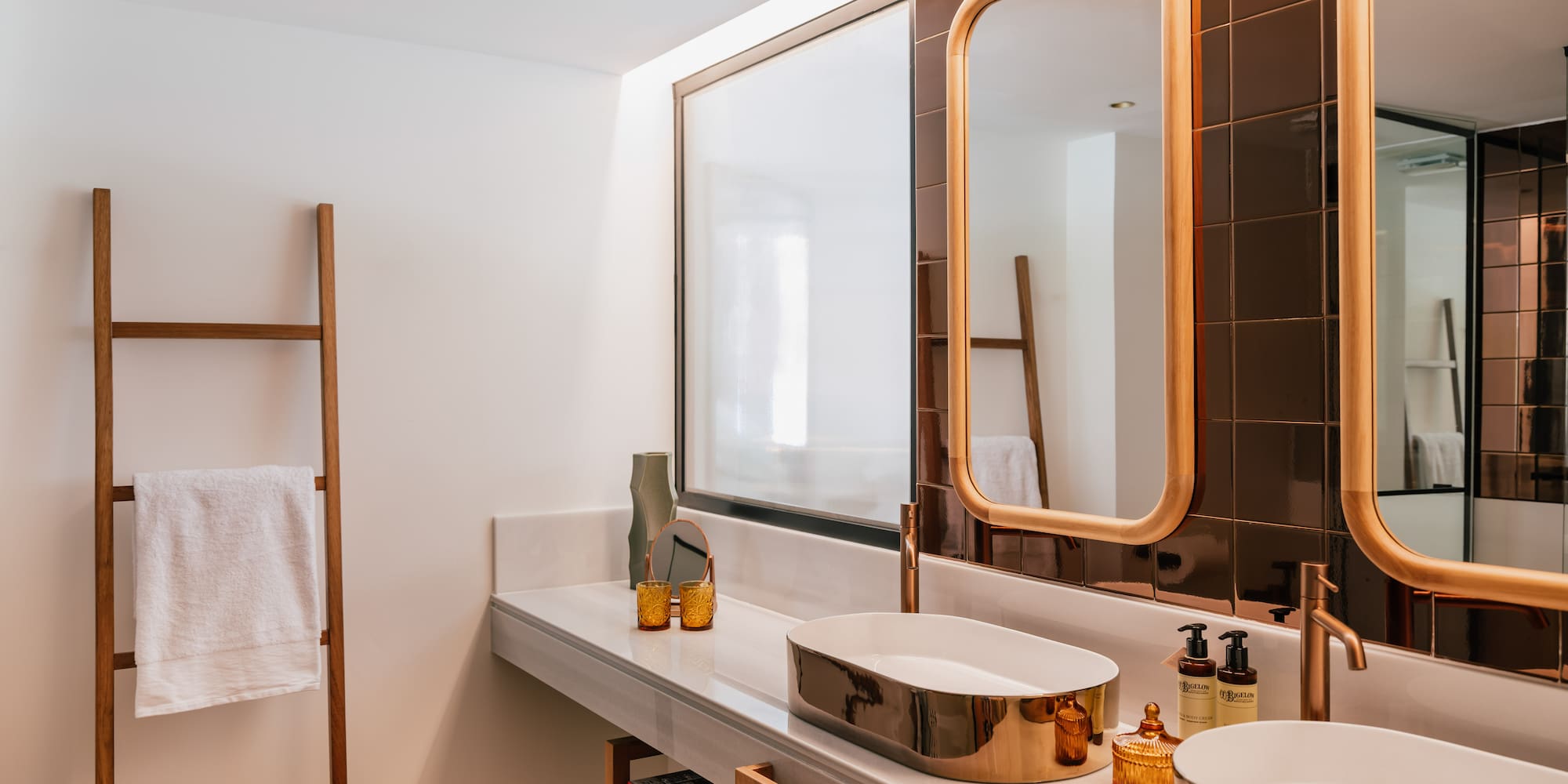 a bathroom with a mirror and sinks