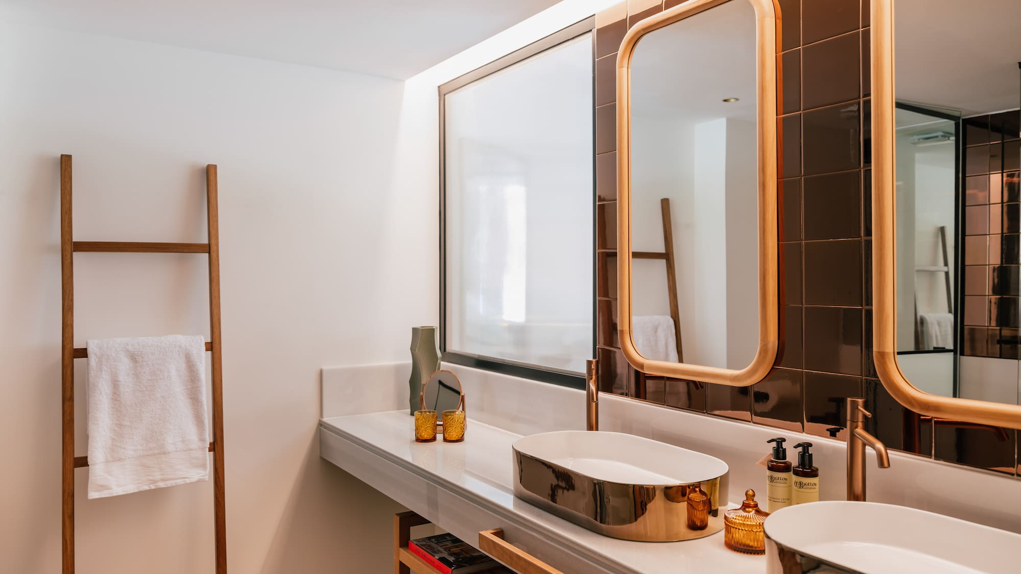 a bathroom with a mirror and sinks