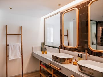 a bathroom with a mirror and sinks