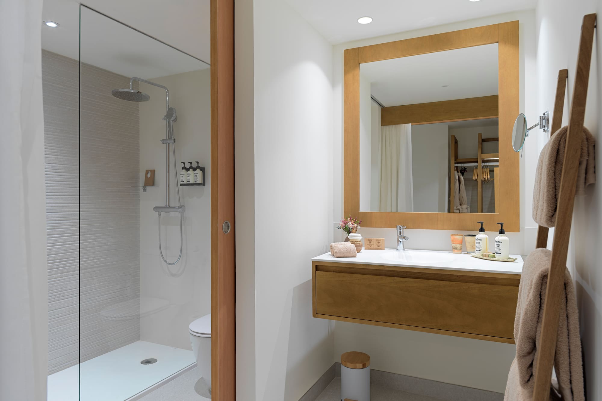 a bathroom with a shower and a sink