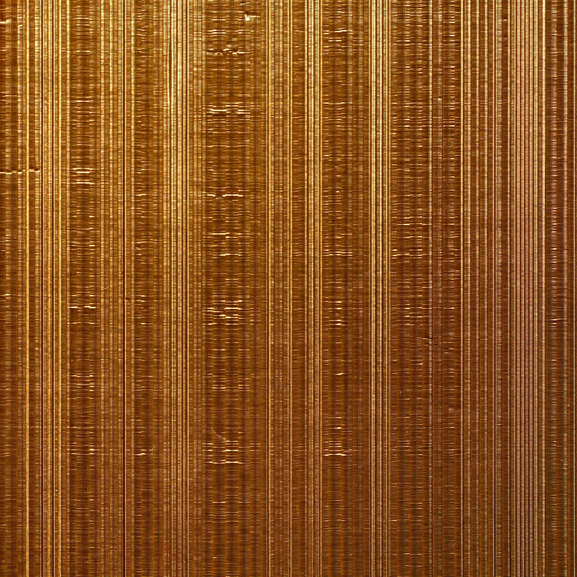 a close up of a gold surface