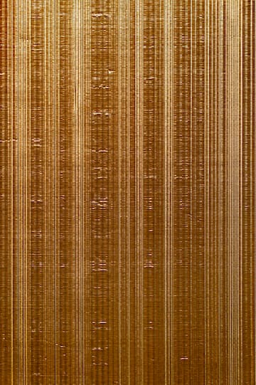 a close up of a gold surface