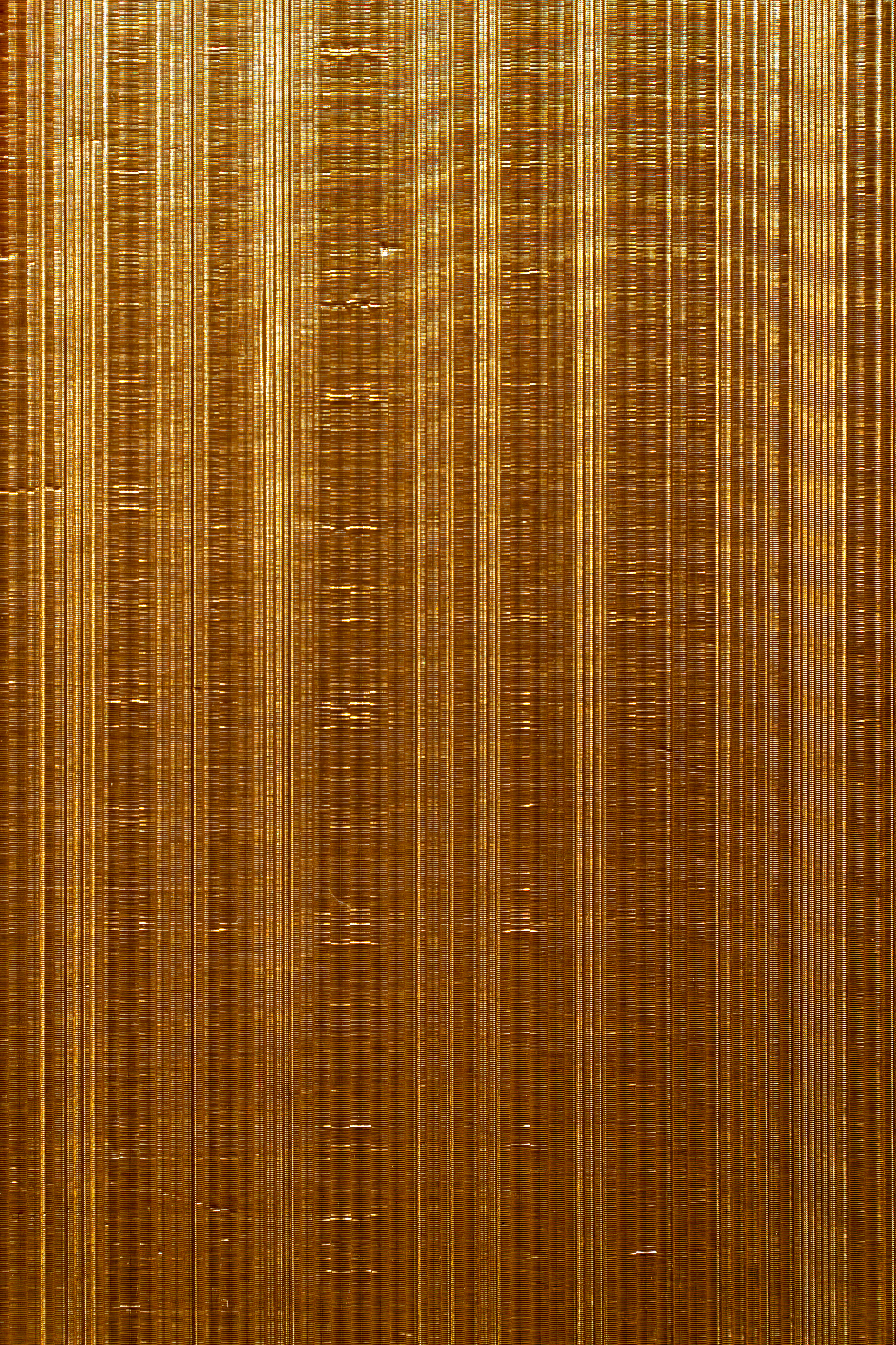 a close up of a gold surface