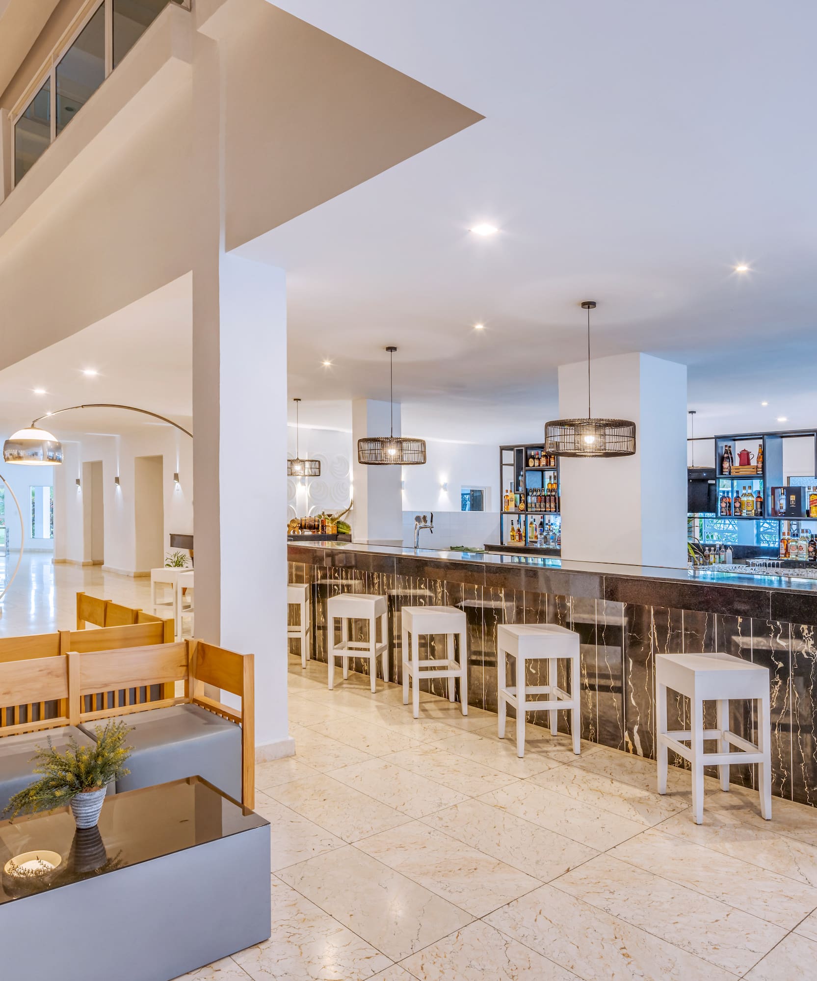 a bar with a counter and chairs