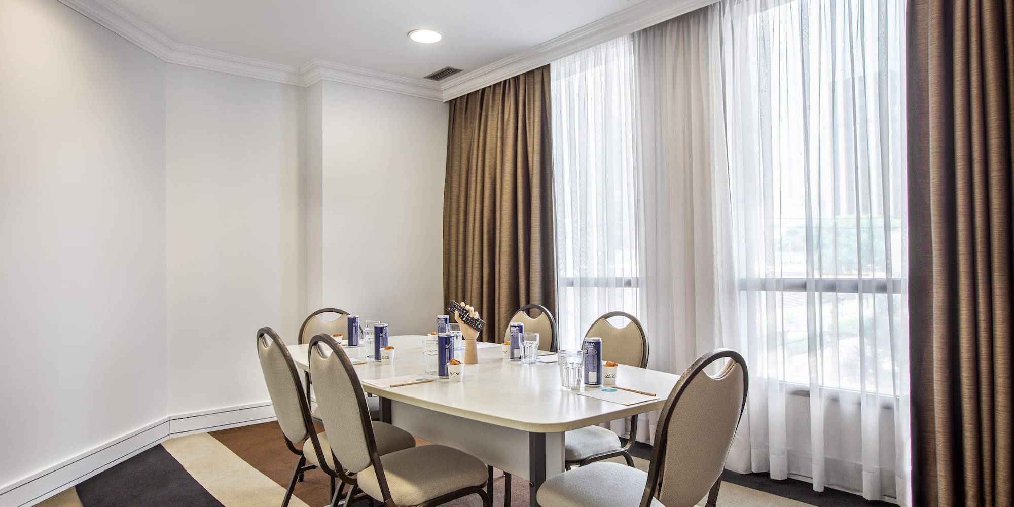 a room with a table and chairs