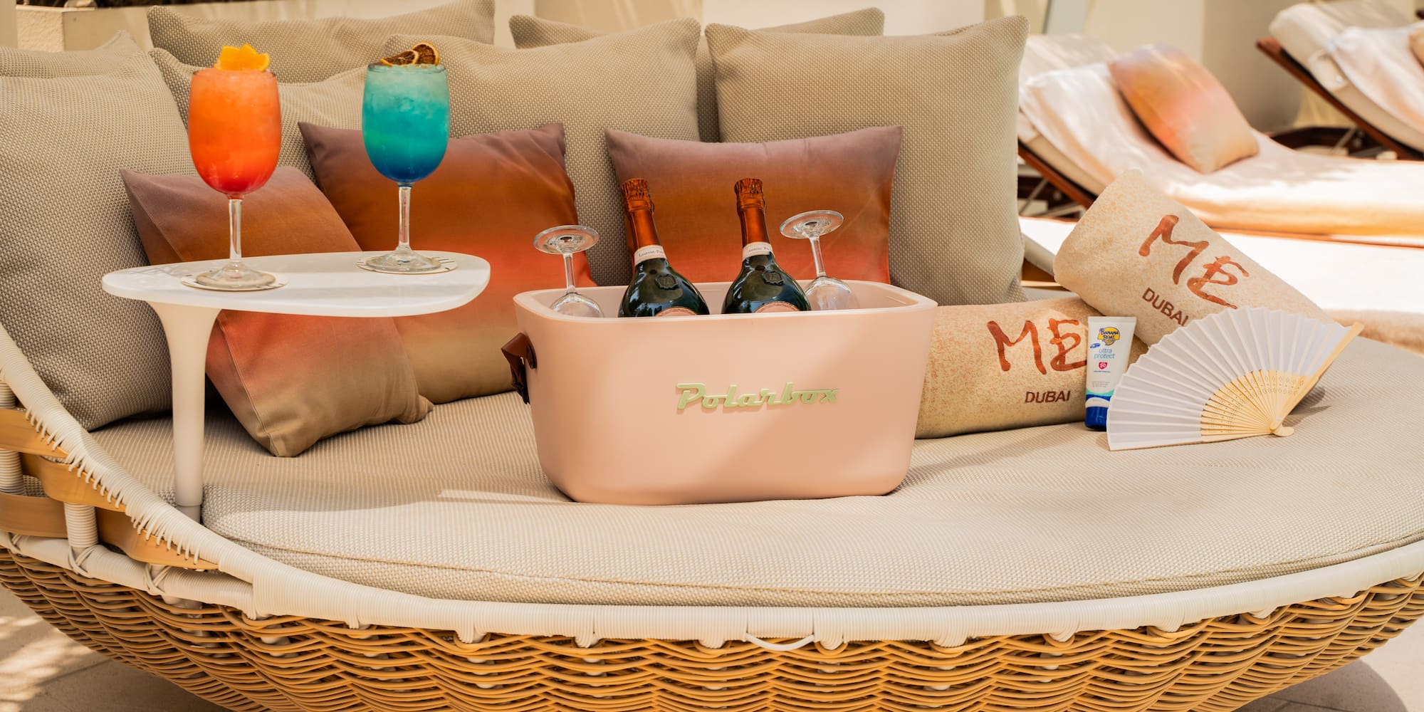 a table with drinks and a basket on it