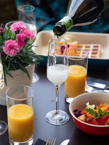a glass of champagne being poured into a glass