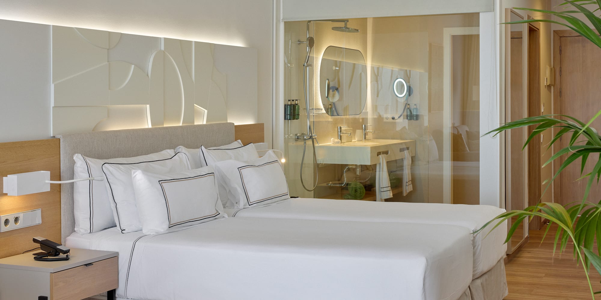 a hotel room with a double bed