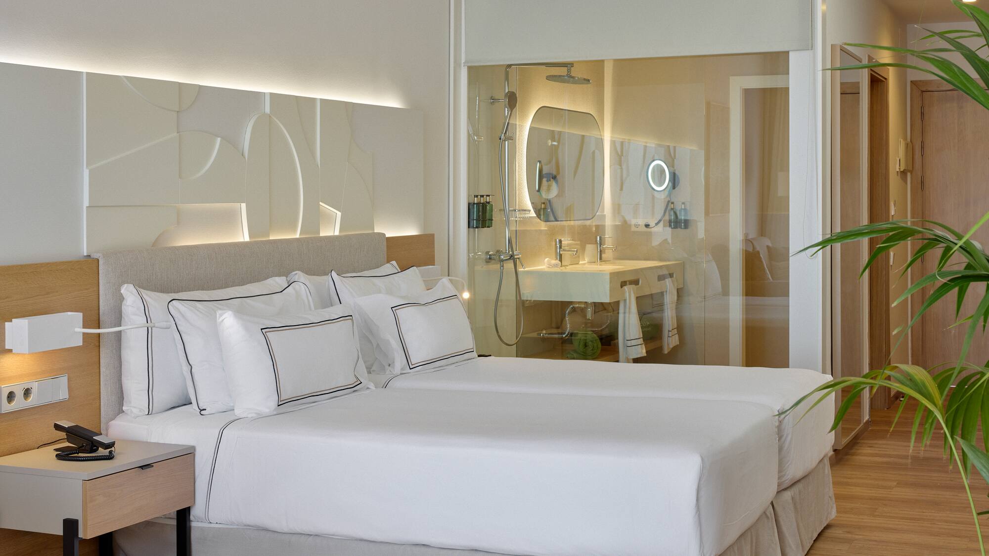 a hotel room with a double bed