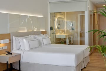 a hotel room with a double bed