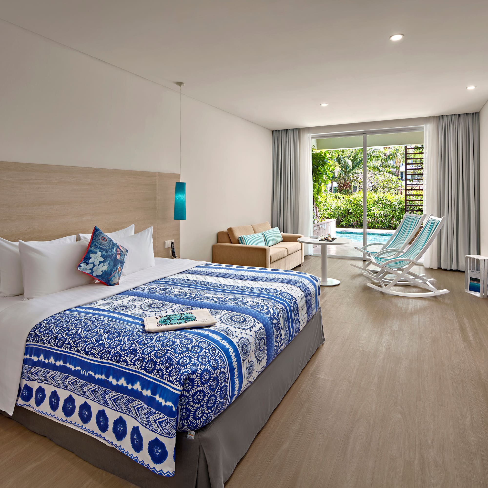 a bedroom with a bed and a chair