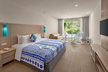 a bedroom with a bed and a chair