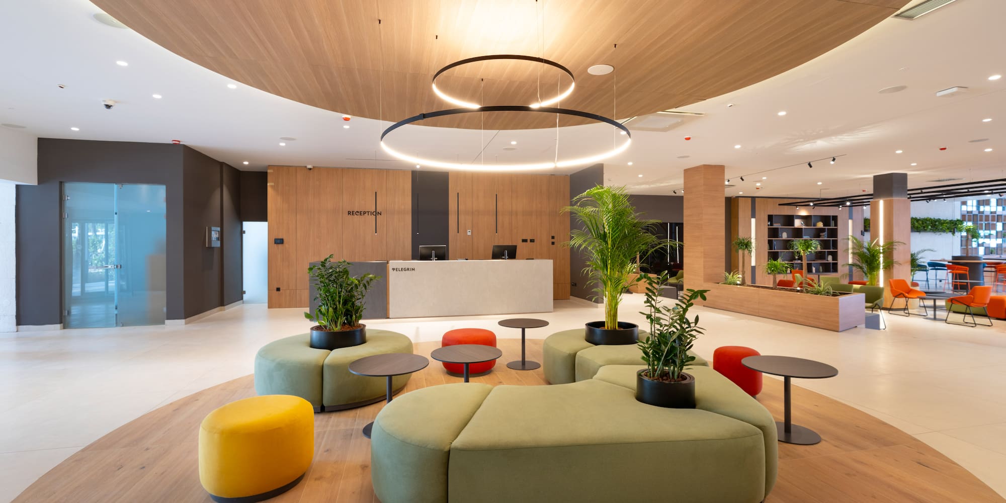 a lobby with a large round table and chairs