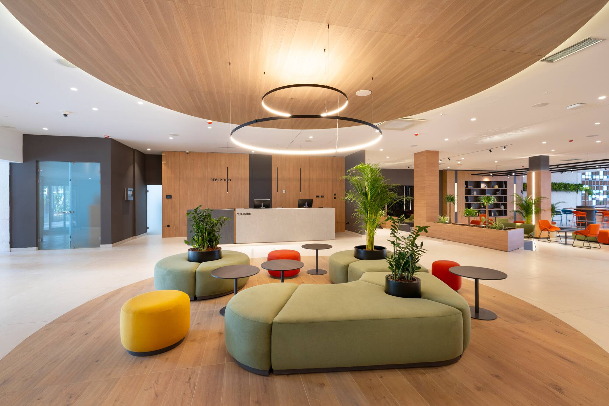 a lobby with a large round table and chairs