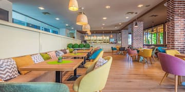 a restaurant with tables and chairs