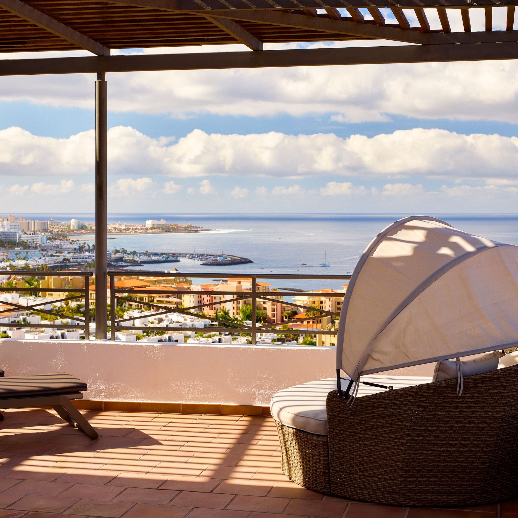 a chair and a chair on a patio overlooking a city