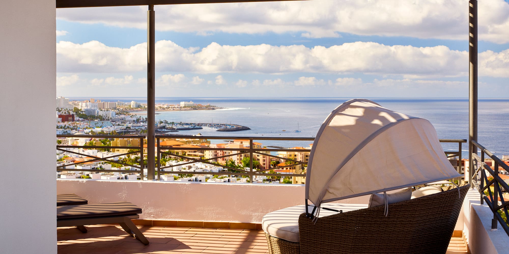 a chair and a chair on a patio overlooking a city