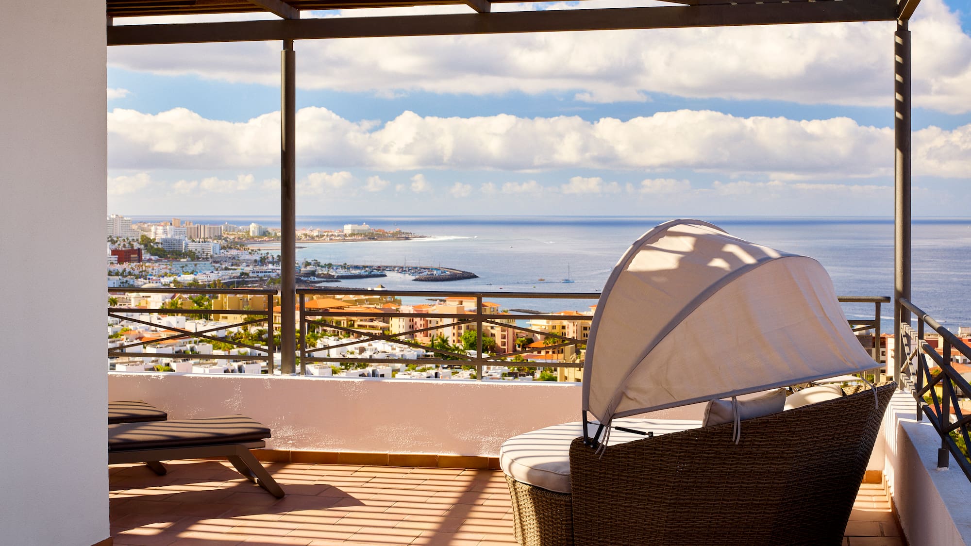 a chair and a chair on a patio overlooking a city