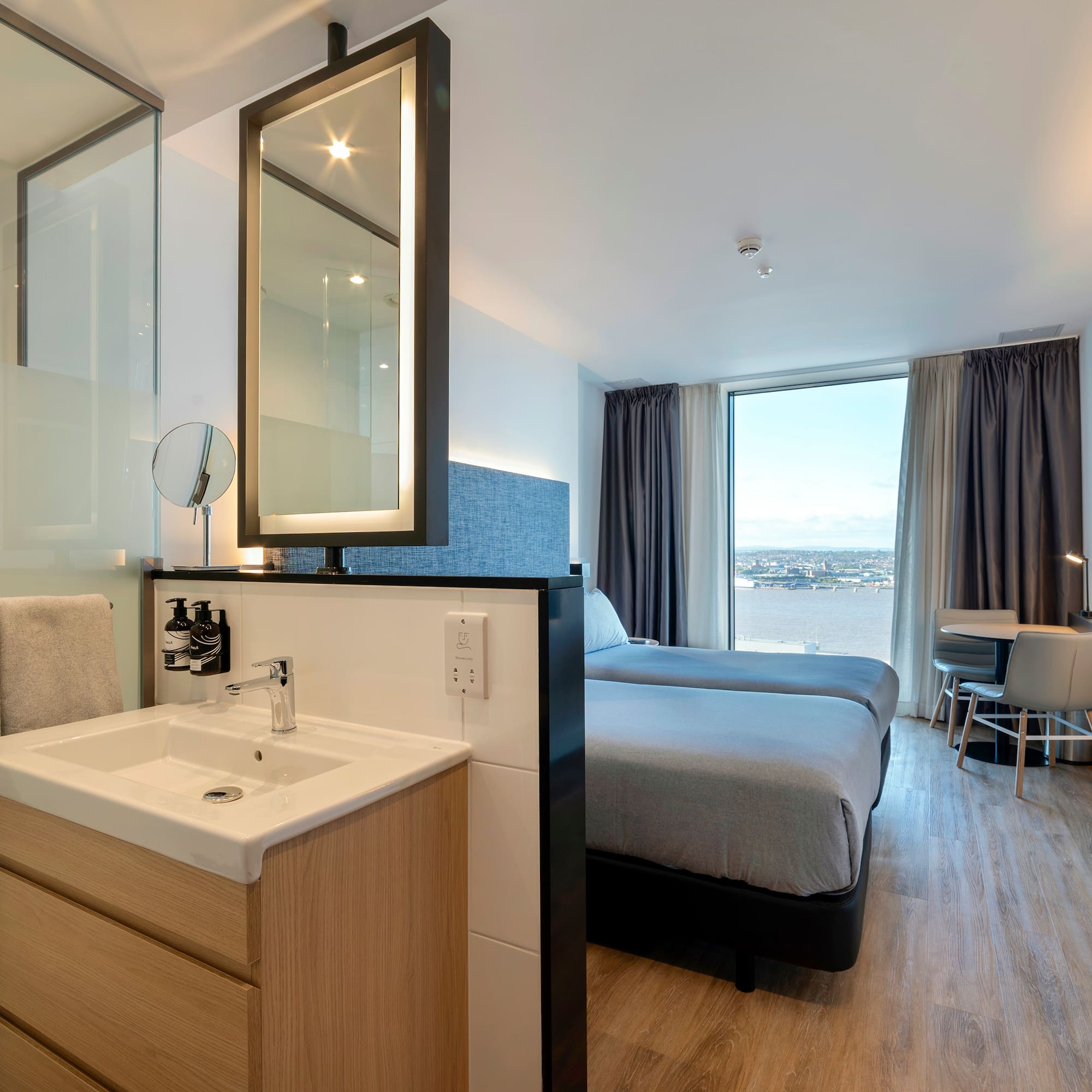 a room with a bed and sink