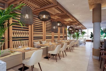 a restaurant with tables and chairs