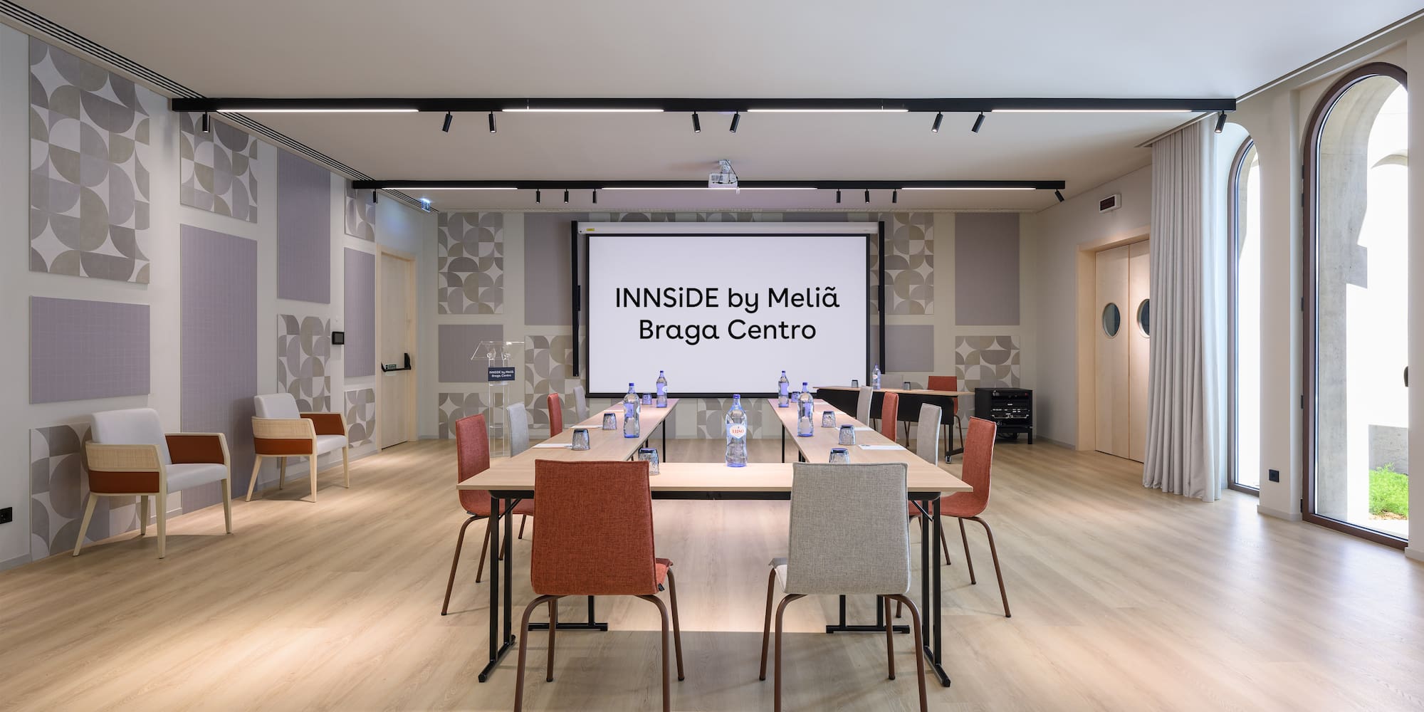 a room with a large table and chairs