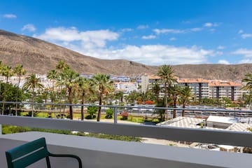 a balcony overlooking a city