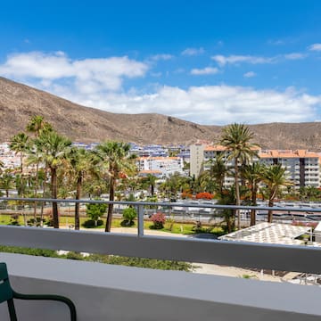 a balcony overlooking a city